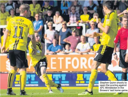  ??  ?? Stephen Quinn shoots to open the scoring against AFC Wimbledon in the Brewers’ last home game.