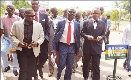  ??  ?? Spokesman to former military President, General Ibrahim Babangida (rtd), Mr. Kassim Afegbua (second right), and his lawyer, Kayode Ajulor (right) reporting to the Force Headquarte­r in Abuja....yesterday