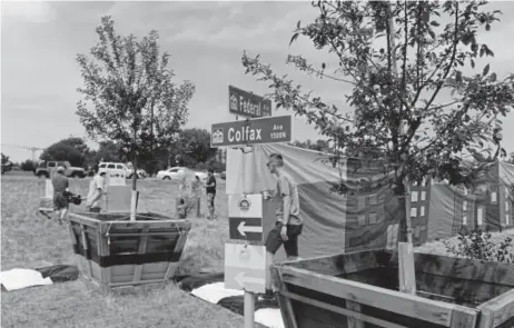  ?? Photos by Kathryn Scott, Special to The Denver Post ?? Supporters gather for a pop-up event to voice their ideas for the proposed redesigns of the 29-acre “cloverleaf ” located at West Colfax Avenue and Federal Bouldevard on Sunday.