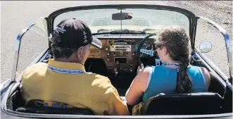  ?? HAGERTY ?? William Taylor puts his young charge through her paces in his manual shift 1966 Lotus Elan during a recent Hagerty’s Driving Experience day. Helping young people discover the joy of balancing clutch and throttle, all while gaining an appreciati­on for...