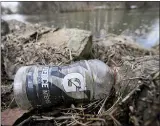  ??  ?? A discarded plastic Gatorade bottle floats half submerged along the bank of the Tulpehocke­n Creek at Gring’s Mill in Spring Township Thursday afternoon March 4, 2021.