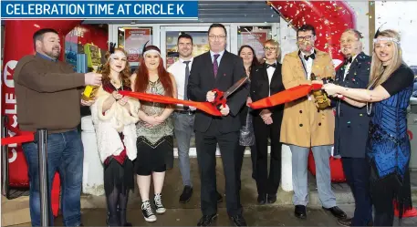  ??  ?? Cllr Michael Sheehan cuts the ribbon at the official opening of the rebranded Circle K filling station at The Quay, New Ross.