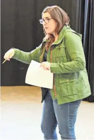  ?? COURTESY OF MILWAUKEE REPERTORY THEATER ?? Director Laura Braza, a 2004 Pius XI High School graduate, works during a rehearsal for the Milwaukee Repertory Theater’s production of “Grounded,” which opens Wednesday.