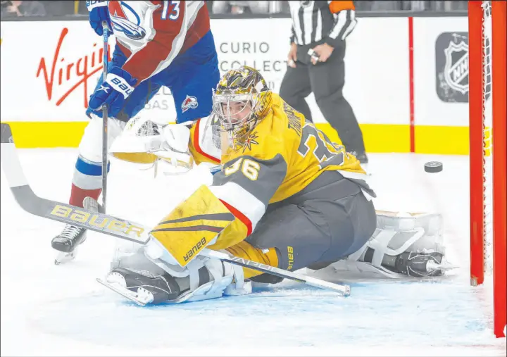  ?? Chase Stevens
The Associated Press ?? Golden Knights goaltender Logan Thompson allows a goal to Avalanche center Nathan Mackinnon on Saturday night during a 3-2 loss at T-mobile Arena.