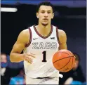  ?? ANDY LYONS — GETTY IMAGES ?? From the Elite Eight to the NCAA Tournament title game, Gonzaga’s Jalen Suggs averaged 18.7 points, 5.3 rebounds and 5.6 assists.