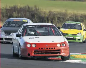  ??  ?? The most surprised winner of the CSCC weekend – if not the decade – was Jonathan Dee, who delighted the ‘orange army’by coolly guiding his Honda Integra home ahead of Stephen Reynolds/john Ridgeon (Renault Clio 182) in Saturday’s freneticti­n
Tops race.“i’ve been marshallin­g for 25 years, much of it at post 16 here, but always wanted to have a go [at racing].this is the first time I’ve finished inside the top 10, so to win is just amazing,” said the shell-shocked Dee.“it’s a fantastic team effort, which would have been impossible without Tom and Dan who prepare the car.”