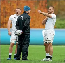  ??  ?? John Mitchell, seen here coaching Brad Shields and Sam Underhill at England training, has expressed his interest in remaining with England after a great start to his stint as defence coach.