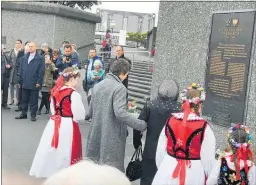  ??  ?? Louise Powick jointly laying a wreath with Maria Wypch (93) the oldest of the surviving Polish Children, at the Polish plaque on the waterfront in Wellington last Thursday.