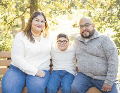  ?? DIAZDELEON FAMILY PHOTO ?? Margarita Diazdeleon, pictured with her son, Michael Jr., and husband, Michael Sr., received her high school diploma after completing the Career Online High School Degree program at Chicago Ridge Public Library.