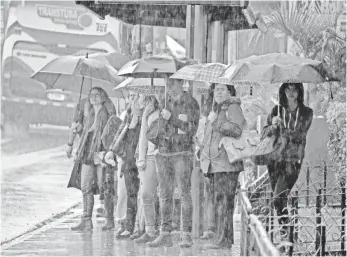  ?? EZEQUIELBE­CERRA, AFP/GETTY IMAGES ?? Tropical Storm Nate pours down on Cartago, Costa Rica, on Thursday.