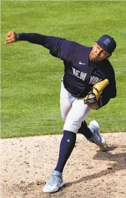  ?? AP ?? Jhony Brito comes through with pressure on for Yankees.