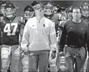  ?? Luis Sinco Los Angeles Times ?? CLAY HELTON, center, has guided USC to 19 consecutiv­e victories at the Coliseum.