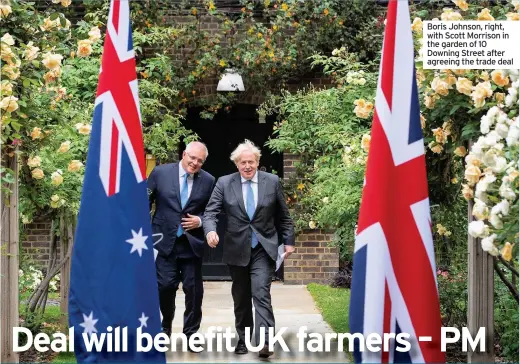  ??  ?? Boris Johnson, right, with Scott Morrison in the garden of 10 Downing Street after agreeing the trade deal