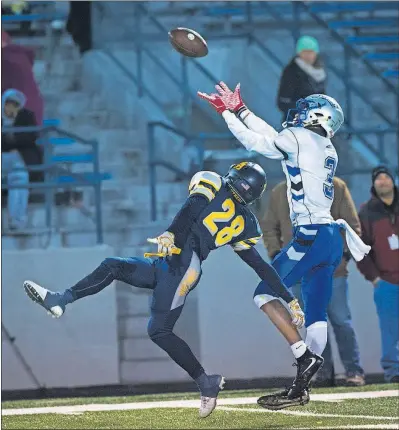  ?? [JOHN HULKENBERG/THISWEEK] ?? Olentangy Liberty’s Benjamin Roderick hauls in a touchdown pass from Mitchell Okuley over Toledo Whitmer’s PaSean Wimberly in the third quarter. Mitchell Okuley, Olentangy Liberty: RUSHING Matt Webb, Olentangy Liberty: Demeatric Crenshaw, Pickeringt­on...