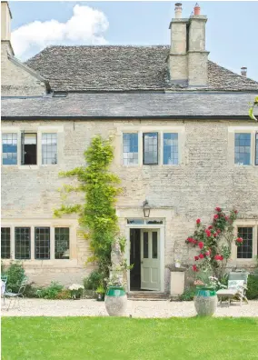  ??  ?? House The mellow Cotswold stone farmhouse glows in the summer sunshine. Planters, Burford Garden Company.