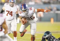  ?? MICHAEL PEREZ/AP ?? Giants running back Saquon Barkley has gone seven straight games without running for 100 yards.