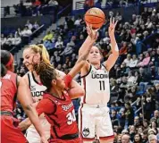  ?? Jessica Hill/Assocaited Press ?? UConn’s Lou Lopez Sénéchal makes a 3-point basket against St. John’s on Tuesday in Hartford.