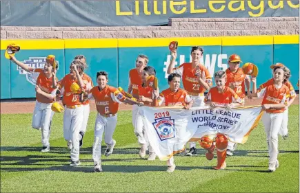  ?? Gene J. Puskar The Associated Press ?? Members of the U.S. Southwest champion team of River Ridge, La., enjoy their victory lap around Lamade Stadium in South Williamspo­rt, Pa., on Sunday after capturing the Little Little League World Series title 8-0 against Caribbean champion Curacao.