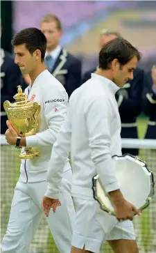  ??  ?? Le due facce della finale Novak Djokovic, 28 anni, e Roger Federer, 33 (Afp)