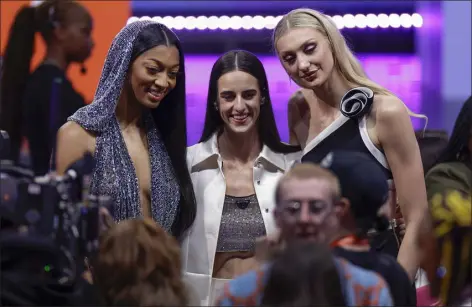  ?? ADAM HUNGER — THE ASSOCIATED PRESS ?? From left, LSU’S Angel Reese, Iowa’s Caitlin Clark, and Stanford’s Cameron Brink, pose for a photo before the start of the WNBA l draft, Monday in New York.