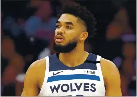  ?? THE ASSOCIATED PRESS FILE PHOTO ?? Minnesota Timberwolv­es center Karl-Anthony Towns, whose mother and six other relatives have died from COVID-19, announced that he has tested positive for the virus.