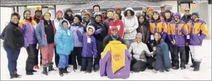  ?? Vermont Ski Areas Associatio­n ?? Members of the Nubian Empire Ski Club, some in their purple and gold club jackets, pose for a photo.