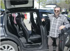  ??  ?? Marco Dolfi with his Tesla X 90D that was on display for the Earth Day celebratio­n at Malden Park on Sunday. The event also featured a hybrid Pacifica, made in Windsor.