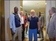  ?? (AP/Judith Besnard) ?? French journalist Olivier Dubois (left) and American aid worker Jeffery Woodke (center) arrive at the VIP lounge at the airport in Niamey, Niger, on Monday.