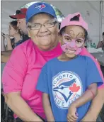  ??  ?? Judy Best sits with her four-year-old granddaugh­ter Kyrah Haddad.