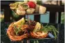  ??  ?? Grilled seafood three-tier platter