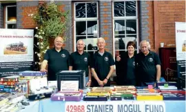  ??  ?? The Stanier Mogul Fund sales stand is no stranger at special events, helping to raisee ssentials umst o aid the locomotive'so ngoingc are. P icturedh ereo n September1 7,2 016a re, left to right: D aveB eer, J ohnA shton, F raserG oulding, Lorraine Busk and Dave Busk. SMF
4296S8T ANIEMRO GUFLU ND