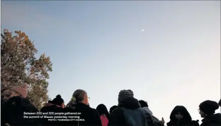  ?? PHOTO / TAURANGA CITY COUNCIL ?? Between 200 and 300 people gathered on the summit of Mauao yesterday morning.