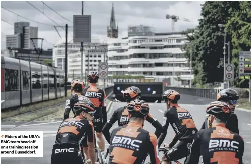  ??  ?? Riders of the USA’S BMC team head off on a training session around Dusseldorf.