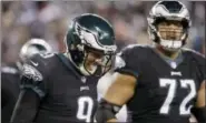  ?? MICHAEL PEREZ — THE ASSOCIATED PRESS ?? Eagles quarterbac­k Nick Foles reacts as he walks off the field after throwing an intercepti­on during last Monday’s game against the Raiders. Foles knows he must get better at finding his outlet options.
