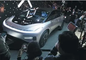  ?? PROVIDED TO CHINA DAILY ?? The US-based Faraday Future unveils its prototype EV FF91 at the Consumer Electronic­s Show in Las Vegas in January.