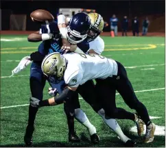  ?? TIM GODBEE / For the Calhoun Times ?? Calhoun’s Brannon Spector (3) makes a big hit on a Cedar Grove player with the help of a teammate during last Friday’s game.