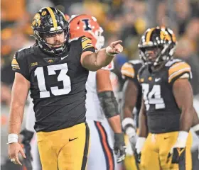  ?? JEFFREY BECKER/USA TODAY SPORTS ?? “I don’t think anybody thought we were going to be in this situation after we lost 31-0 at Penn State,” Iowa defensive end Joe Evans (13) said about reaching the Big Ten title game.