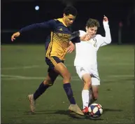  ?? Christian Abraham / Hearst Connecticu­t Media ?? Weston’s Jordan Blunschi, left, tries to fend off Joel Barlow’s Rice Davis as he works the ball during the SWC South championsh­ip in 2020.