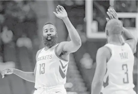  ?? Michael Wyke / Associated Press ?? James Harden, left, and Chris Paul are sharing the ball. They are averaging a combined 19.5 assists in an average of 26.5 minutes each.