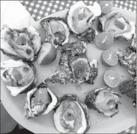  ??  ?? Freshly shucked Pacific oysters await diners at Playa Los Pinos, a shallow wading beach popular with families.