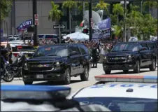  ?? MARTA LAVANDIER — THE ASSOCIATED PRESS ?? The motorcade carrying former President Donald
Trump arrives Tuesday for his federal court hearing on dozens of felony charges accusing him of illegally hoarding classified documents and thwarting the Justice Department’s efforts to get the records back.