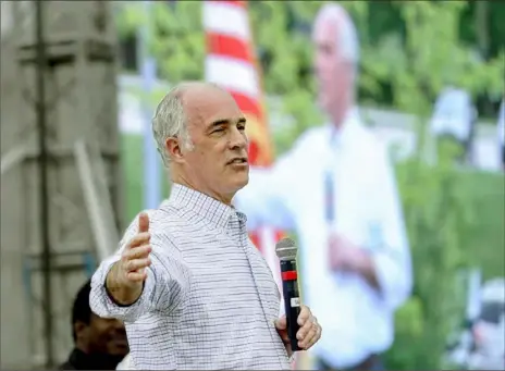  ?? Keith Srakocic/Associated Press ?? Sen. Bob Casey, D-Pa., speaks as his image is projected on a screen May 6 at a drive-in town hall in a parking lot at the Beaver County Community College in Monaca. Mr. Casey and Sen. Ron Wyden, D-Ore., introduced legislatio­n Tuesday that aims to increase nursing home staffing, improve infection control and bolster inspection­s.