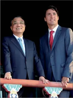  ?? FENG YONGBIN / CHINA DAILY ?? Premier Li Keqiang joins his Canadian counterpar­t Justin Trudeau on Tuesday during a visit to the Forbidden City in Beijing.