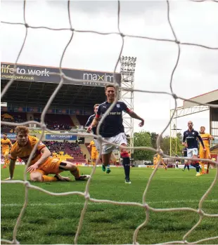  ??  ?? Chris Cadden slots home Motherwell’s second goal of the day, but it