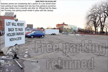  ?? NEWS PHOTO COLLIN GALLANT ?? Business owners are complainin­g that a portion of a city-owned downtown parking lot was changed from two-hour free parking to accommodat­e pass holders from a recently sold other lot. Officials told the News late Thursday, free parking would remain in place until late January.