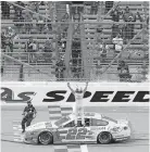  ?? [AP PHOTO/ ORLIN WAGNER] ?? Joey Logano celebrates in front of the crowd after winning a NASCAR Cup Series race Sunday at Kansas Speedway in Kansas City, Kan.