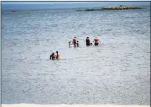  ?? File photo ?? The beach offers relief as a heat wave drives temperatur­es into the 90s in Stamford recently.