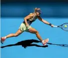  ??  ?? Angelique Kerber stretches to make a return during first round match.