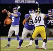  ?? JULIO CORTEZ - THE ASSOCIATED PRESS ?? New York Giants quarterbac­k Davis Webb (5) passes against the Pittsburgh Steelers during the fourth quarter of a preseason NFL football game, Friday, Aug. 11, 2017, in East Rutherford, N.J.