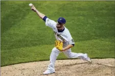  ?? MORRY GASH — THE ASSOCIATED PRESS ?? Milwaukee Brewers relief pitcher David Phelps is headed to the Phillies.